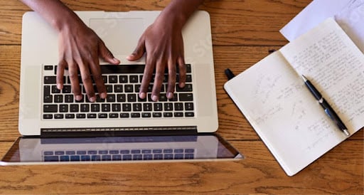 hands-on-a-laptop-keyboard-overhead-view